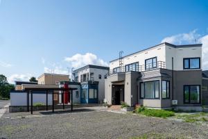 a row of houses with a parking lot at SEKKA - Vacation STAY 20179 in Shimo-furano