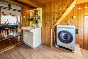 a washer and dryer in a tiny house at Aso Play - Harmony and Unity - Vacation STAY 42457v in Uchinomaki
