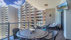 a patio with a table and chairs on a balcony at 2BR 2BA condo @ Las Palomas Cabrillo 804 in Puerto Peñasco