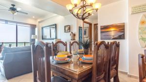 a dining room with a table and chairs at Las Palomas 2 BR 2 BA Diamante 707 in Puerto Peñasco