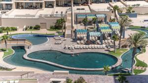 an aerial view of a pool at a resort at Las Palomas 2 BR 2 BA Diamante 707 in Puerto Peñasco