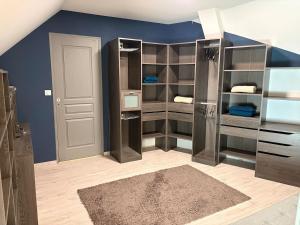 a room with a large closet with open shelves at Charmante maison avec piscine in Turquant +21 photos