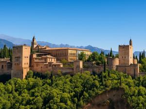 a castle on top of a hill with trees at Loft artístico Espacio Lirola Centro in Granada