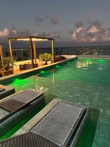 Бассейн в Flat Mar Doce Lar na praia do Bessa или поблизости