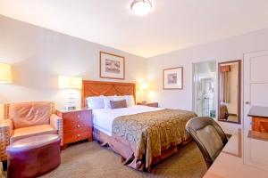 Ένα ή περισσότερα κρεβάτια σε δωμάτιο στο Historic Coronado Motor Hotel by OYO +69 φωτογραφίες