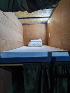 Postel nebo postele na pokoji v ubytování Hotel Capsula SANTO DOMINGO