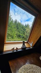 a window in a room with a view of trees at Chalet in Freilingen Blankenheim mit Seenähe mitten in der Natur in Blankenheim +48 photos