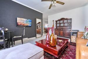 a living room with a couch and a table at Aviator's Nest in Kempton Park
