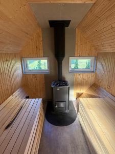 an inside view of a woodburning stove in a cabin at Jönåker Cottage & Sauna in Jönåker