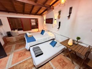 an overhead view of a room with two beds and a table at Compostela cabaña privada (private cabin for rent) in Jardin +29 photos