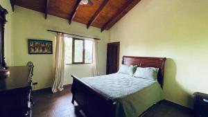 a bedroom with a bed in a room with a window at Luxury Villa Heated Pool, Firepit & Pool Table in Arroyo Frío +26 photos