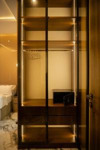 a closet with a basketball hoop in a bedroom at Awka Luxury One Bed in Awka