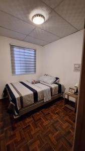 En eller flere senge i et værelse på Hidden House