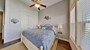 a bedroom with a bed and a ceiling fan at Prominence 30A - Holiday House in Watersound Beach +31 photos
