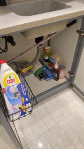 a shelf under a counter with food and other items at شقة استديو- السليمانية in Riyadh