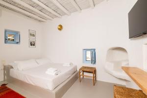 Postel nebo postele na pokoji v ubytování Traditional Mykonos Village House