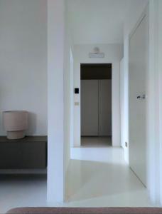 a white room with a hallway with a door at Villa Maria in Onno +38 photos