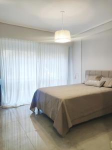 En eller flere senge i et værelse på Bella Stanza