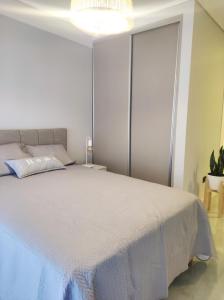 En eller flere senge i et værelse på Bella Stanza