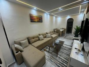 a living room with a couch and a table at Moly House in Aswan +7 photos