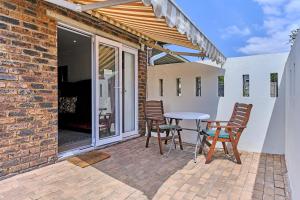 a patio with a table and chairs on a patio at Clear Skies in Kempton Park