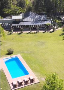 an overhead view of a swimming pool in a yard at Finca el Maitén Hotel Boutique in San Rafael