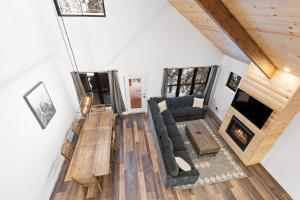 a living room with a couch and a table at Alpine Glow Ski Haus in Whitefish