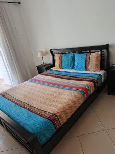 a bed in a room with at Olivier Asilah Golf Piscines in Asilah +56 photos