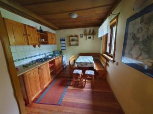 an overhead view of a kitchen with a table at Domki Bartoszówka 