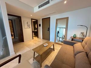 a living room with a couch and a table at Clara Suite in Mar del Plata