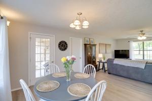 a dining room and living room with a table and chairs at Charming Mountain Home Getaway with Gas Grill! in Mountain Home