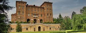 a large brick building with stairs in front of it at La Cascina in Agliè