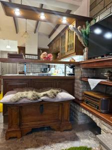 a kitchen with a table in the middle of it at Lydias house II in Arachova