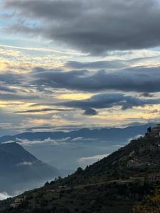 a cloudy sky over a hill with a valley at Lydias house II in Arachova +24 photos
