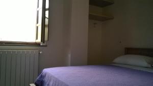 A bed or beds in a room at Il Borgo Di Pegui