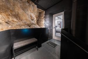 a fireplace in a room with a stone wall at Cave-Salzburg in Salzburg