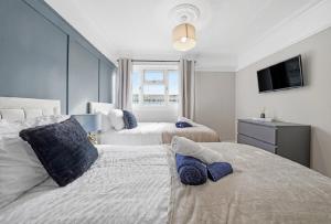 Ένα ή περισσότερα κρεβάτια σε δωμάτιο στο Sarc Properties