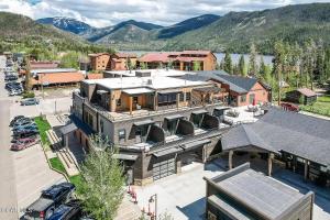 an aerial view of a large building with a parking lot at Stylish Grand Lake Retreat - King Bed - Walk to Lake in Grand Lake