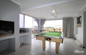 a living room with a pool table in it at 87 on Sunbird in Langebaan