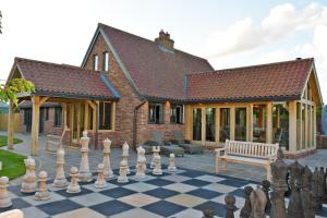 a chess board in front of a house at Dingle Dell in Great Driffield