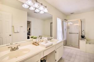 a bathroom with two sinks and a large mirror at Pet-Friendly Houston Rental with Private Patio! in Houston +28 photos
