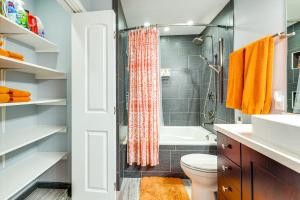 a bathroom with a shower and a toilet and a sink at New Braunfels Escape, Walk to Gruene Hall! in New Braunfels +28 photos