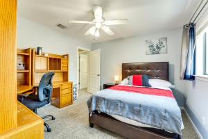 a bedroom with a bed and a desk and a chair at New Braunfels Escape, Walk to Gruene Hall! in New Braunfels