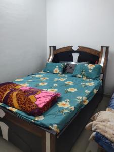 Ένα ή περισσότερα κρεβάτια σε δωμάτιο στο Jay Home stay