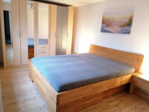 a bedroom with a large bed in a room at Käpt'n Brandt in Osteel
