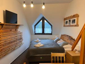 Postel nebo postele na pokoji v ubytování Penzion Mona Rooms & Apartments