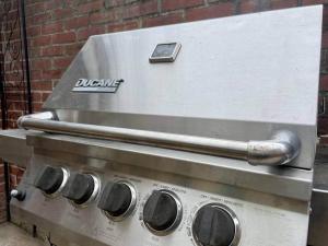a grill with a cell phone on top of it at THE HANNAH HOUSE - DOWNTOWN HISTORIC LANCASTER in Lancaster +7 photos