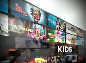 a wall with lots of movies on it at THE STEVENS STUDIO - HISTORIC DOWNTOWN LANCASTER in Lancaster