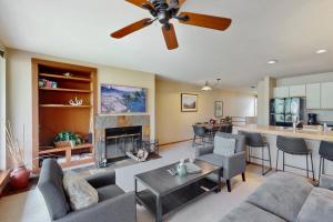 a living room with a couch and a fireplace at Simba Run 2305 in Vail