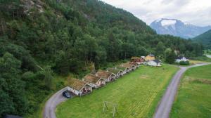 an aerial view of a village in the mountains at Hjelledalen Hyttesenter in Hjelle
